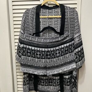 Black and white shorts set . Open front jacket top. 100 percent polyester